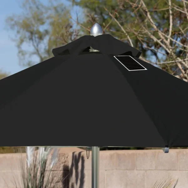 Close-up of a BajaMate Umbrella with a 2" silver aluminum pole and UV-resistant fabric in vibrant blue, showcasing its heavy-duty stainless steel crank mechanism and integrated 20-watt solar panel with a micro USB charging port for poolside use. The black umbrella