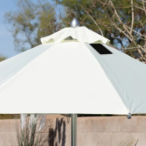 showcasing its heavy-duty stainless steel crank mechanism and integrated 20-watt solar panel with a micro USB charging port for poolside use. The tan umbrella